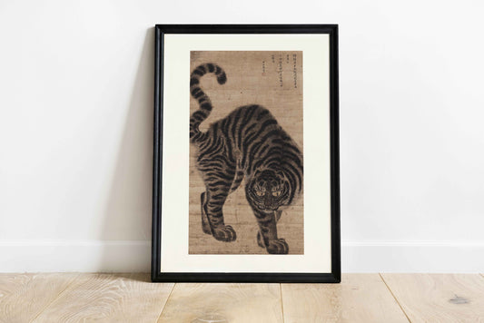 Art print of a traditional Korean tiger from the Joseon Dynasty in Minhwa folk style, black ink on paper, vertical format with white borders, framed.