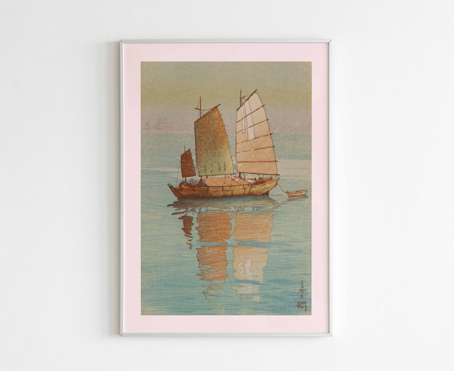 A framed 'Sailing Boats' Japanese print by Hiroshi Yoshida hanging on a wall, enhancing a minimalist home decor.