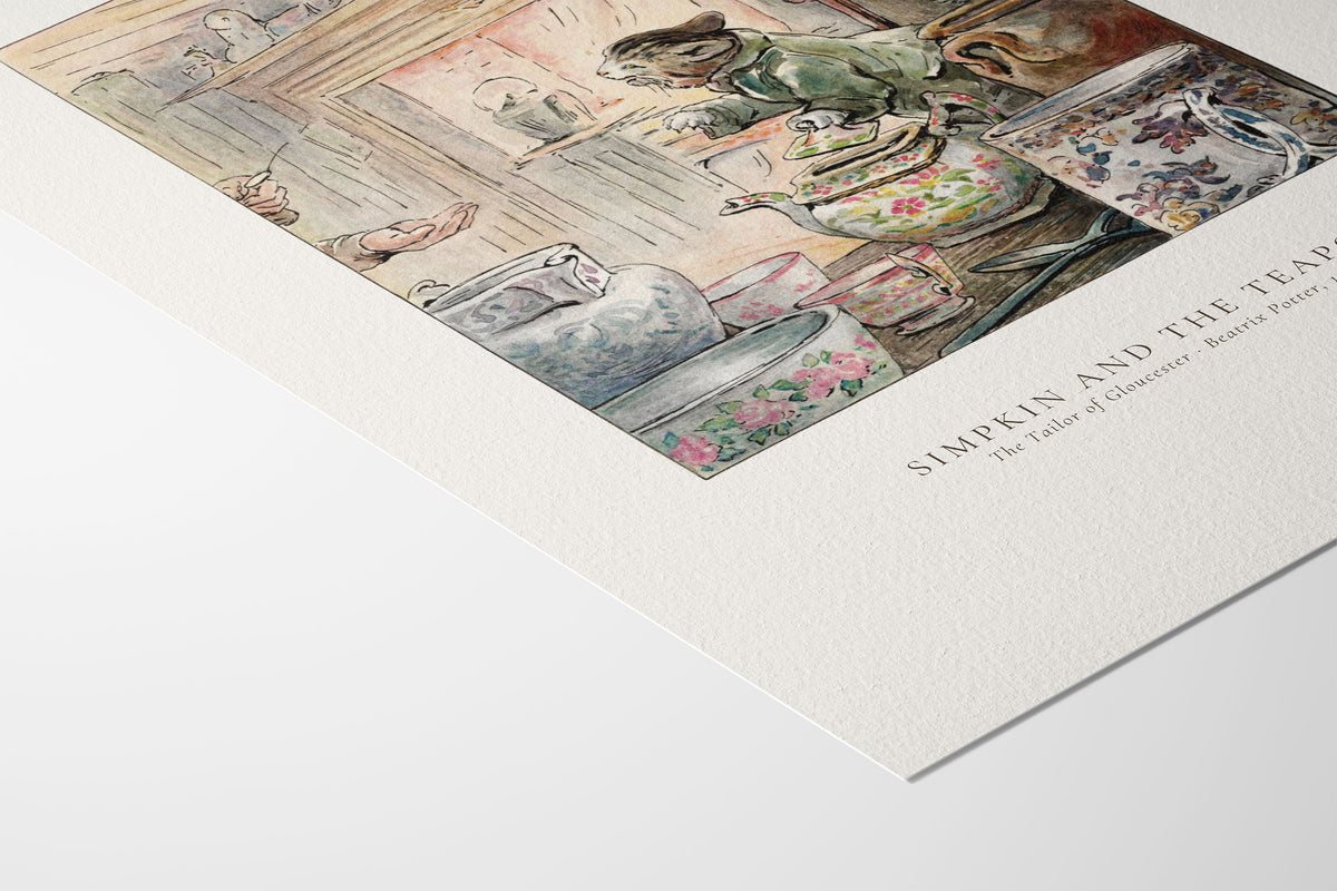 A close-up of a printed art poster or book cover showing a whimsical tea-table scene with teapot, cups, and flowers, printed on textured white paper with the title 'SIMPKIN AND THE TEA POT'.