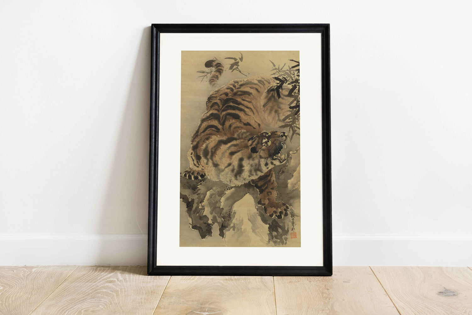 Japanese tiger painting from the Edo Period by Ganku, depicting a roaring tiger amidst bamboo, with fine ink and wash details.