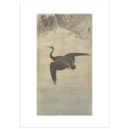 Traditional Japanese woodblock print of a cormorant over water with trees and flowers by Ohara Koson.