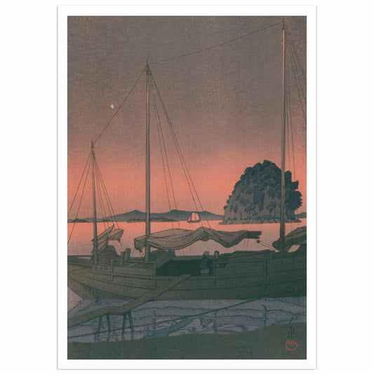 Kawase Hasui 1934 woodblock print showing two traditional Japanese sailing boats with tall masts moored in calm waters at sunset, with a weathered dock in the foreground, silhouetted coastal village buildings and a tree-crowned rocky island in the background, under a dramatic coral-pink and lavender-gray sky