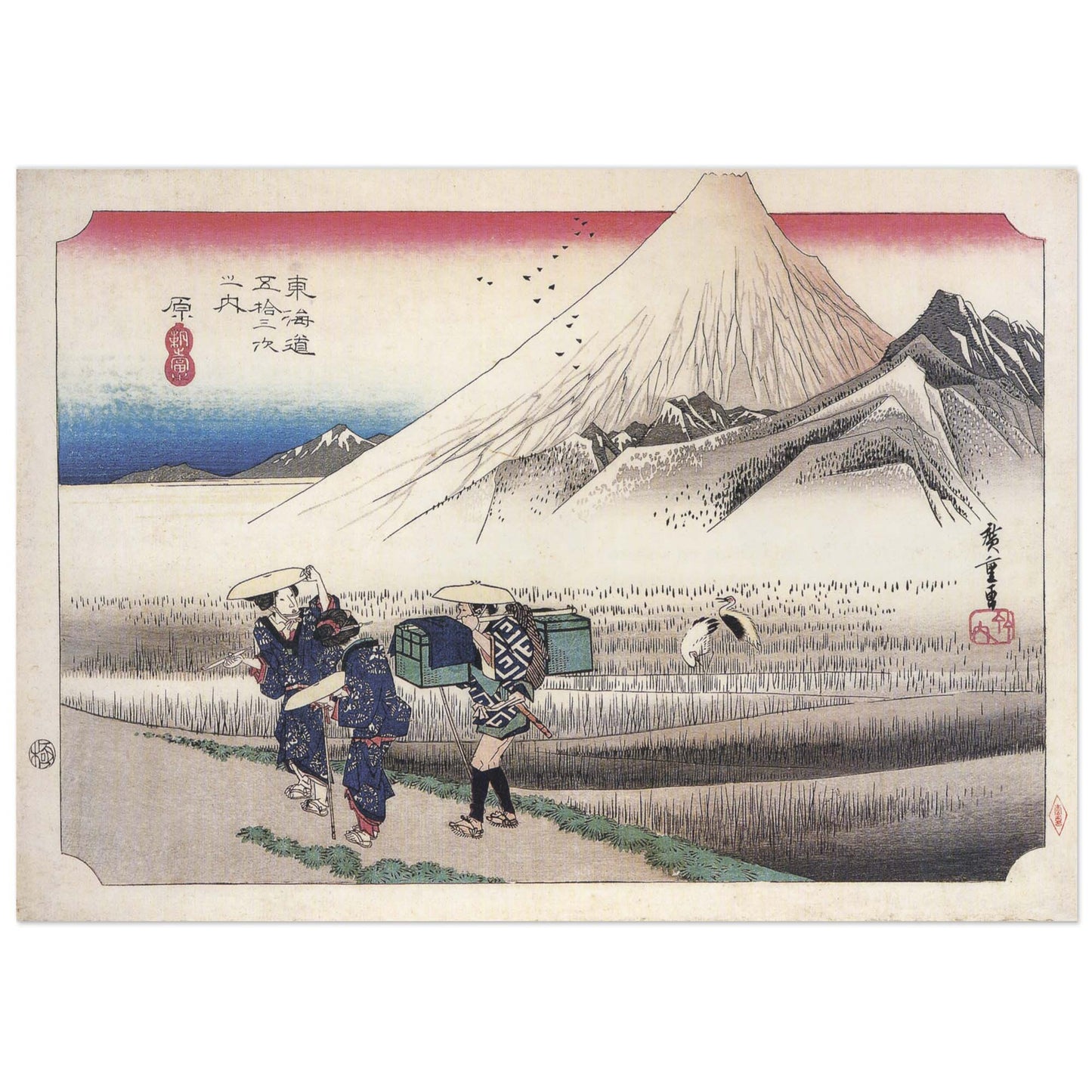 Japanese woodblock print by Hiroshige showing snow-capped Mount Fuji at dawn, two women travellers with a porter on a marsh path, and cranes taking flight.