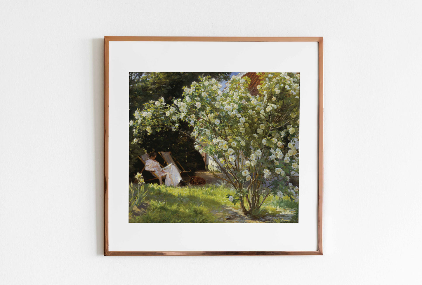 Framed artwork of a garden scene with people sitting under a tree.