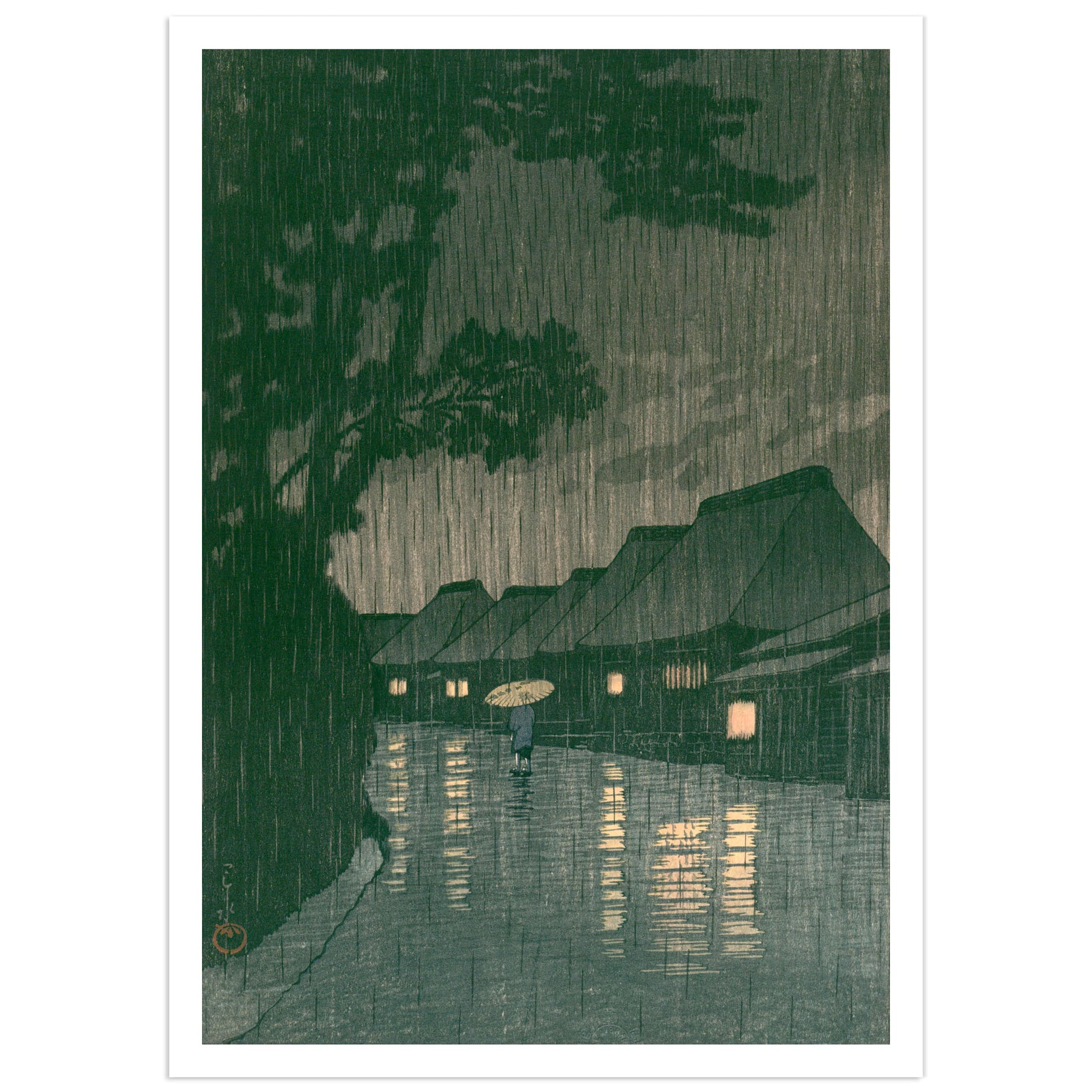 Sōshū Maekawa no Ame (Rain at Maekawa, Sagami Province) — Kawase Hasui. Japanese woodblock print depicting a solitary figure with a paper umbrella walking a flooded village road at night in heavy rain, lantern light reflecting on wet ground, deep green pine trees looming overhead. Shin-hanga art print.