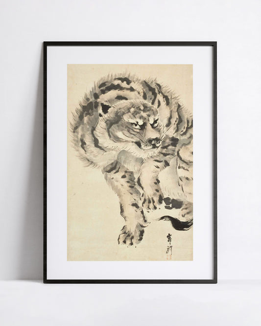 A framed art print featuring a detailed black and white ink painting of a japanese tiger on a beige background, displayed against a clean white wall.
