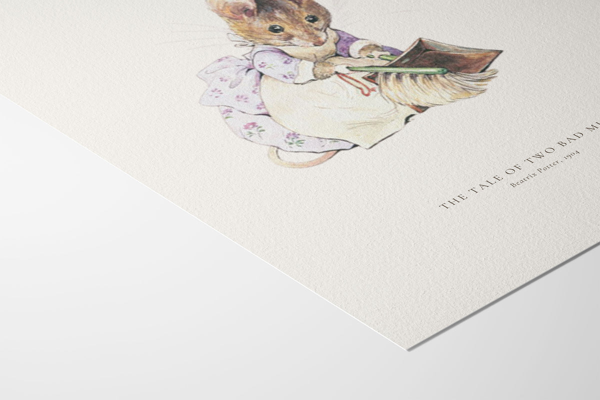 A close-up of a textured off-white art print featuring a watercolor illustration of a small mouse in a floral dress holding a book, with the title 'THE TALE OF TWO READERS' printed in black serif text.