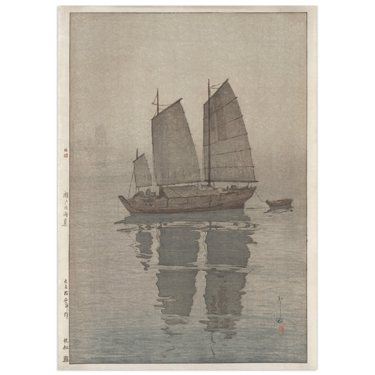 Sailing Boats: Mist by Hiroshi Yoshida (1926), shin-hanga woodblock print of a sailboat with grey sails anchored in thick fog, a second boat barely visible behind, reflections on still water