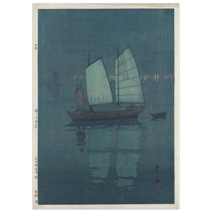 Sailing Boats: Night by Hiroshi Yoshida (1926), shin-hanga woodblock print of a sailboat with pale green sails anchored on a deep blue sea at night, distant shore lights on the horizon